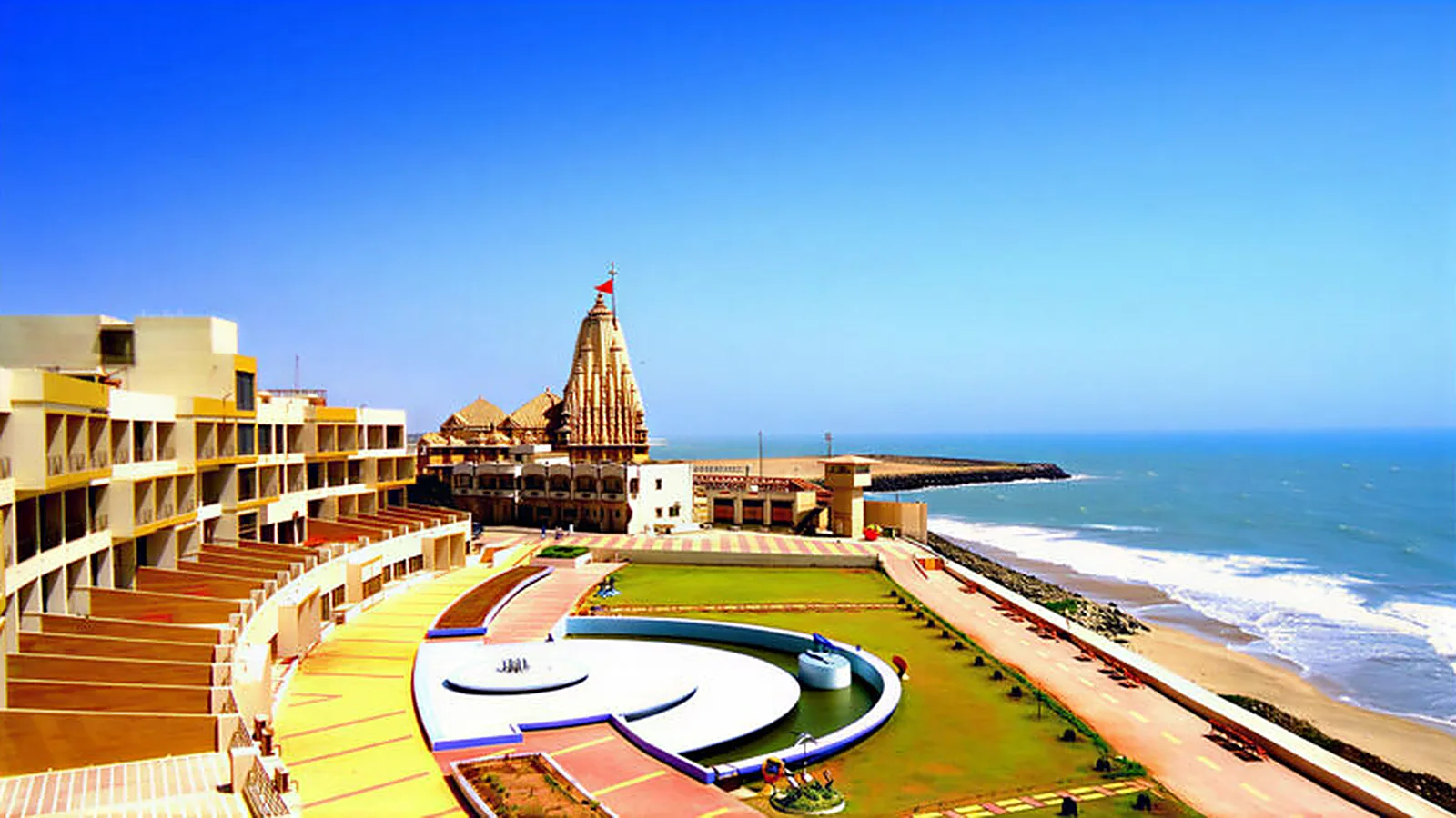 Aerial view of Sagar Darshan Guest House in the foreground, Somnath temple just behind it and the Arabian Sea on the right